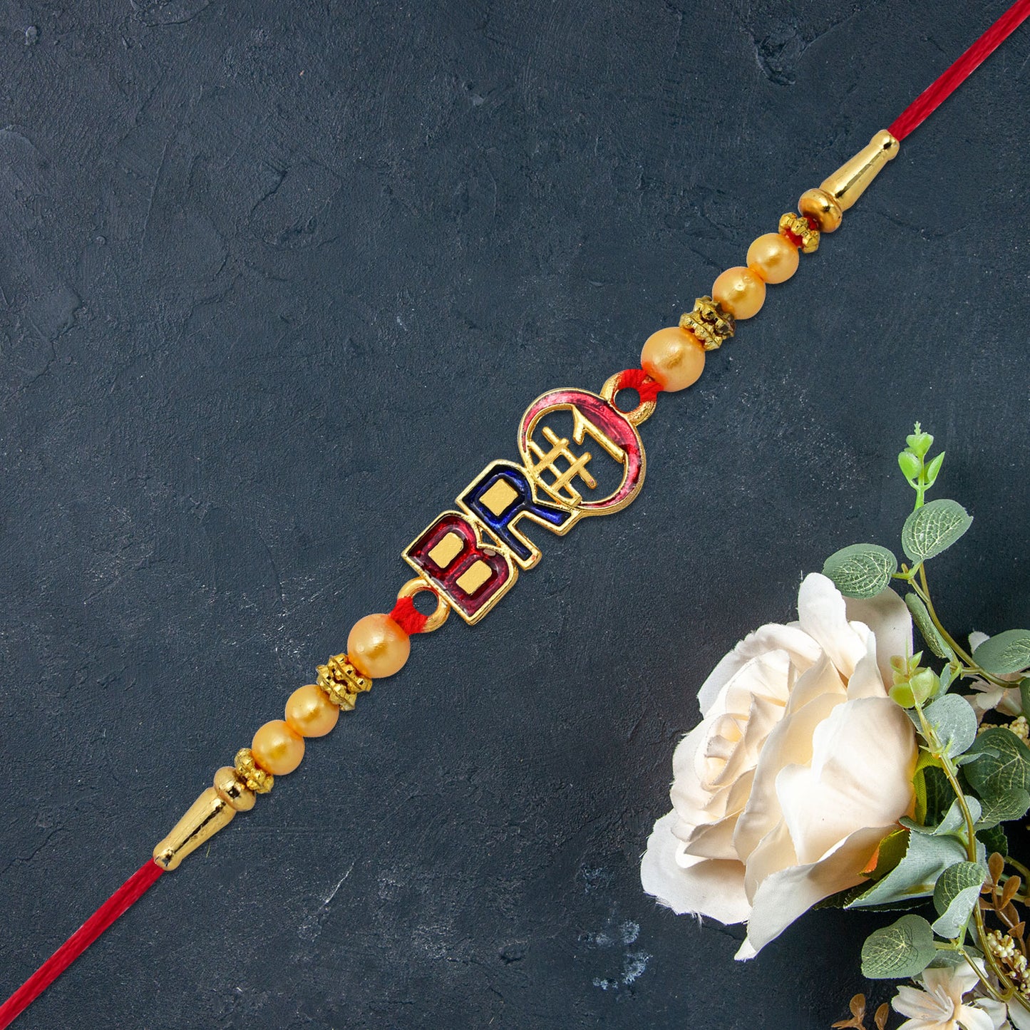 Bro 1 Rakhi With Golden Beads Enamel Finish