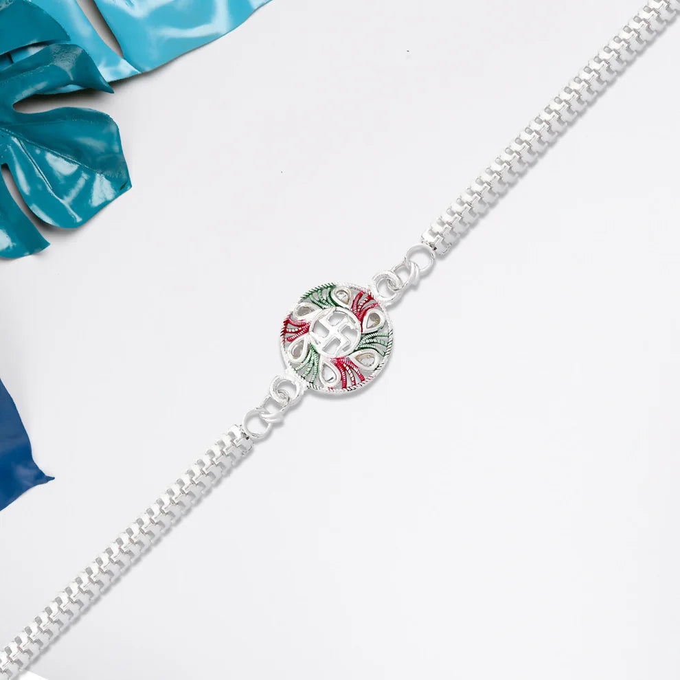 Swastik Design Rakhi With Tricolor Enamel And Silver Metal Chain